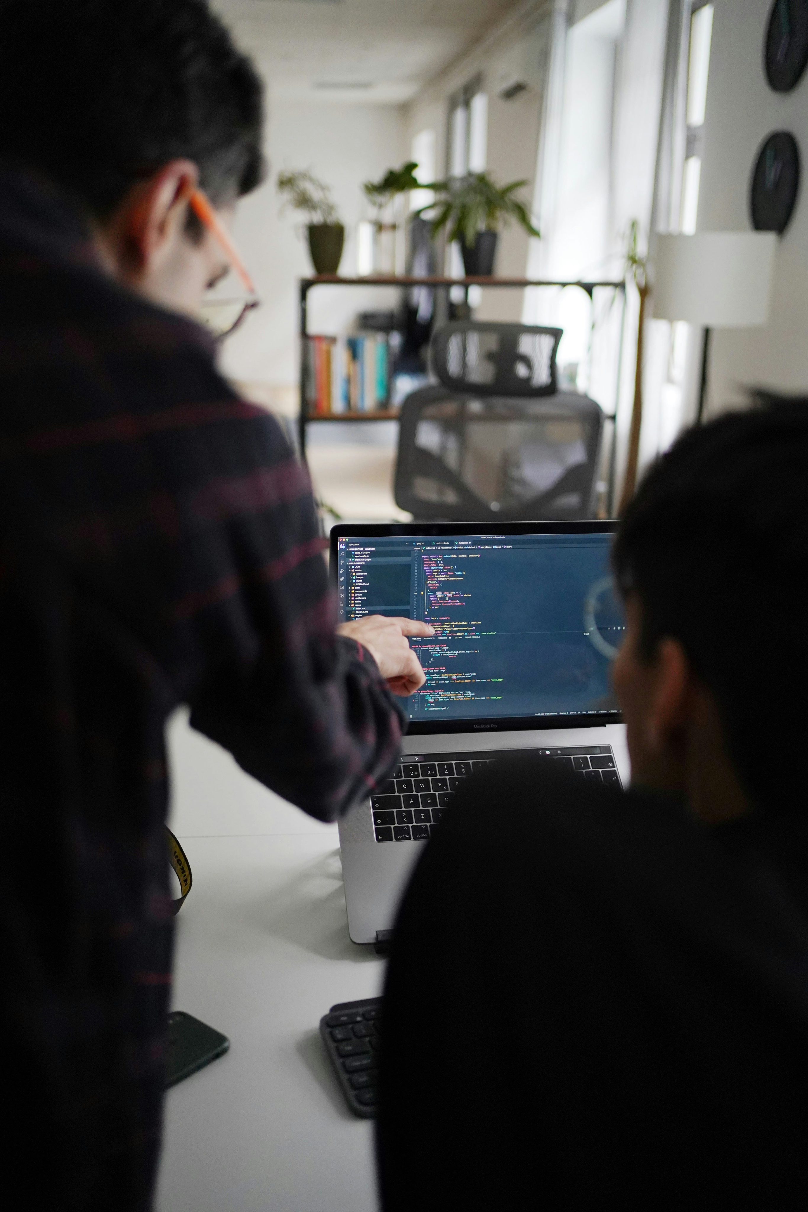 Two members of the Filter team collaborating on software development