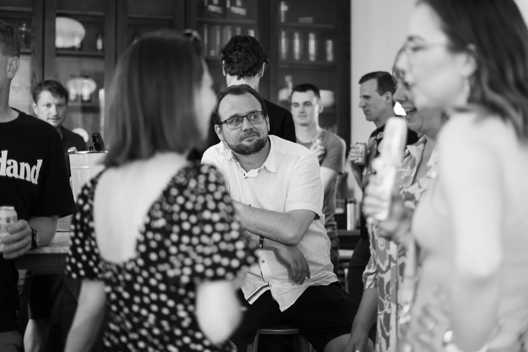 Filter team members talking at a social event