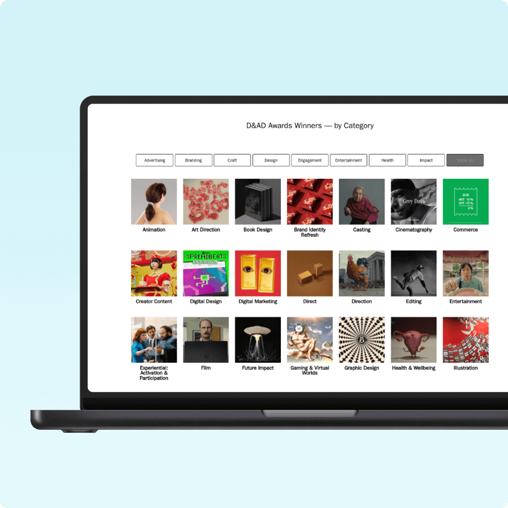 A laptop screen displays a grid of DAAD Awards winners categorized by creative fields, including animation, graphic design, and cinematography. Each category features vibrant images representing various award-winning works.