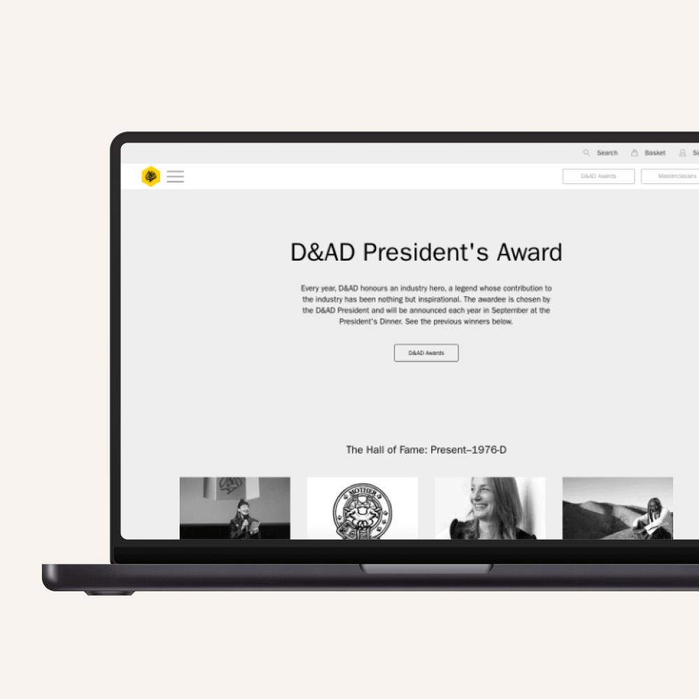 A laptop screen displays the D&AD President's Award webpage, showcasing industry honorees and their contributions to creativity and design. The layout features an overview and links to notable winners.