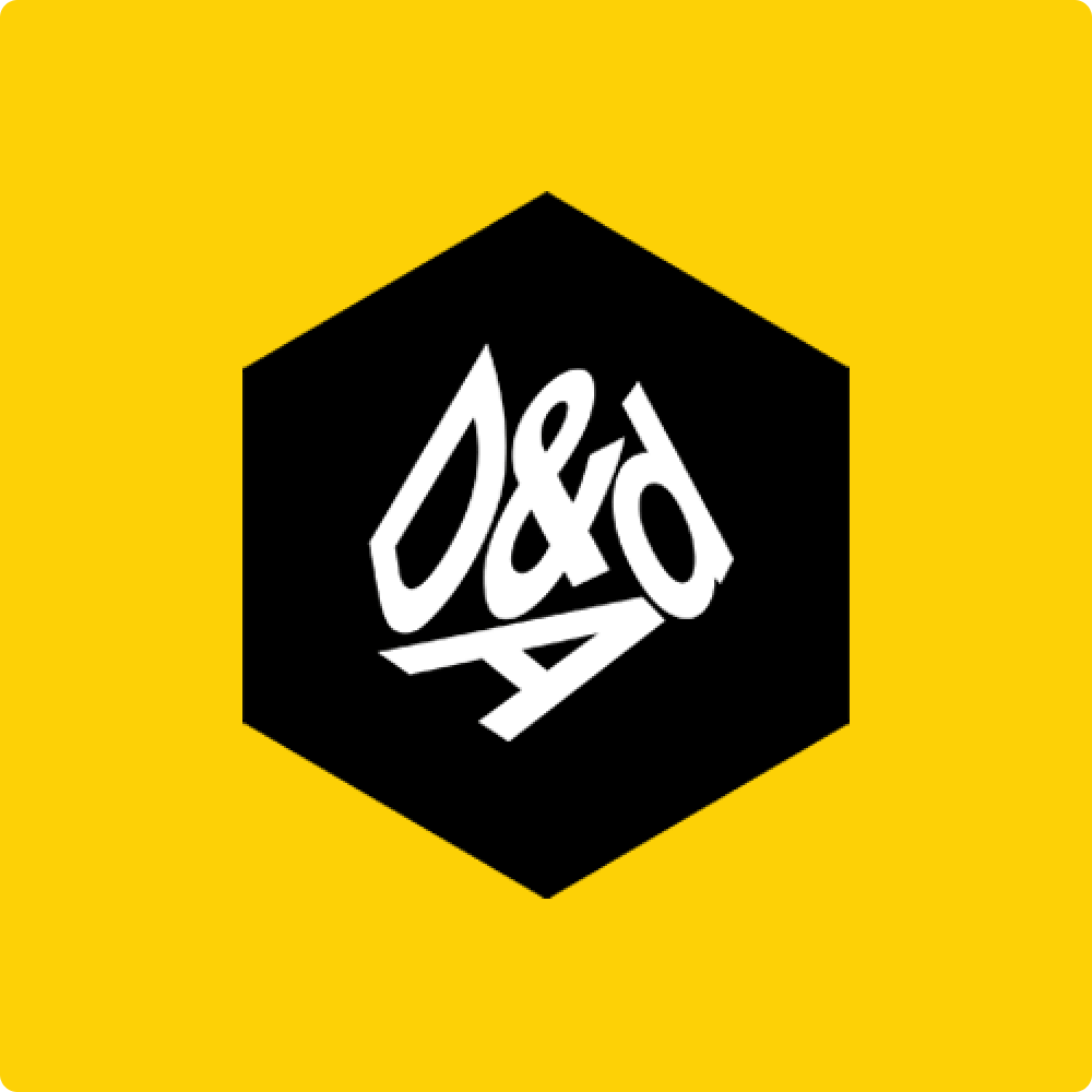 A hexagonal logo featuring the letters "D&AD" in white on a black background, set against a bright yellow backdrop.