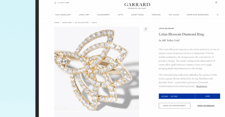 A laptop displays the product page for the Lotus Blossom Diamond Ring from Garrard, featuring a detailed description and pricing information alongside an image of the ring.