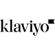 A black and white line drawing of a small bird perched on a thin branch. The bird faces left, with its tail slightly raised and wings folded close to its body. The minimalistic illustration emphasizes simplicity and elegance.
