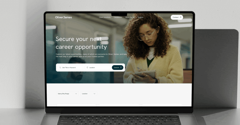 A laptop on a sleek surface displays a career opportunity website, highlighting job security options with a professional woman engaging with the site, suggesting a focus on employment and career growth.