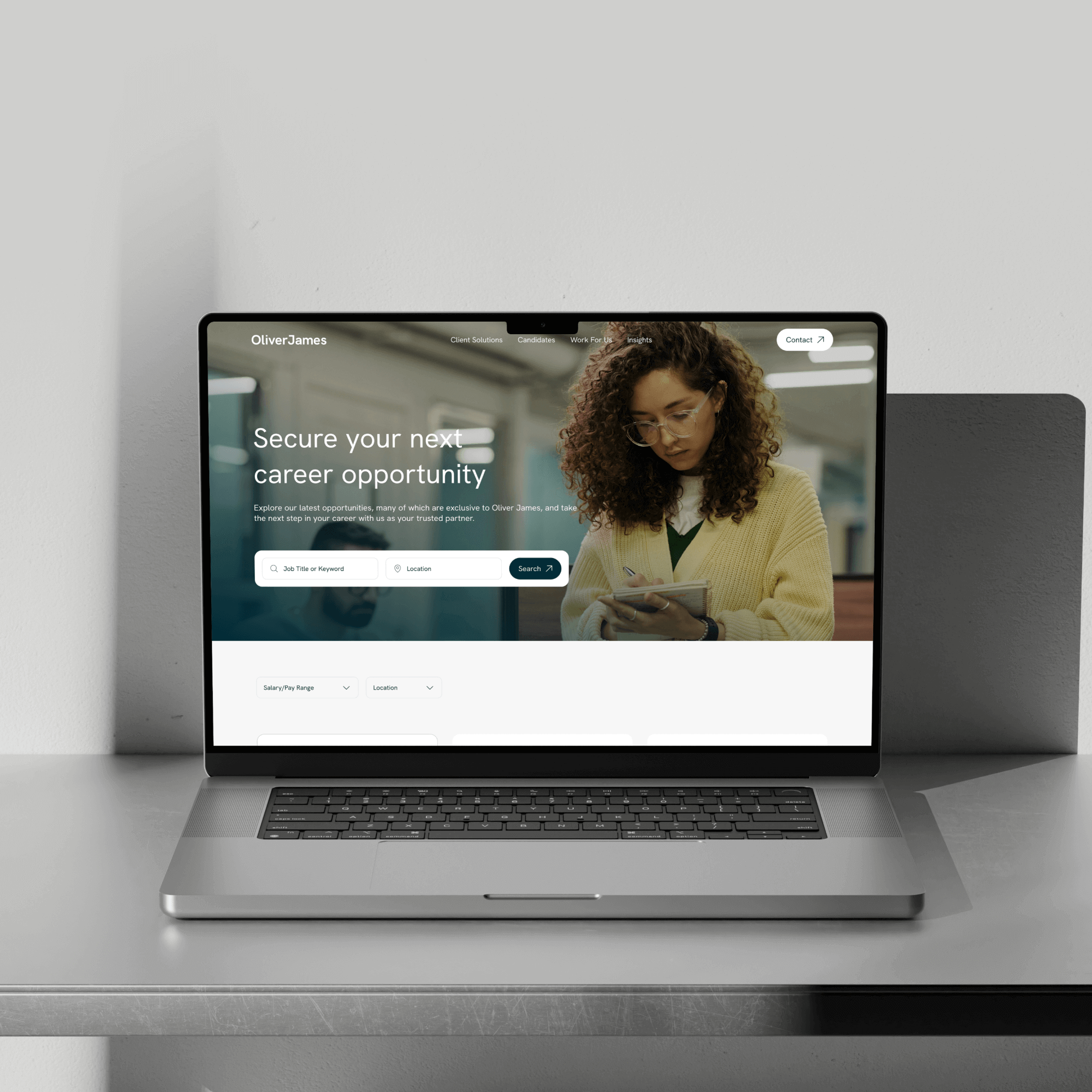 A laptop on a sleek surface displays a career opportunity website, highlighting job security options with a professional woman engaging with the site, suggesting a focus on employment and career growth.