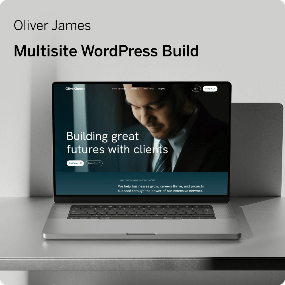 Laptop computer showing a screenshot of the sophisticated Oliver James recruitment website, using dark colours.