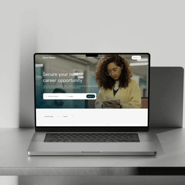 A laptop displays a career opportunity website, showing a woman engaging with her phone, suggesting recruitment or job search themes.