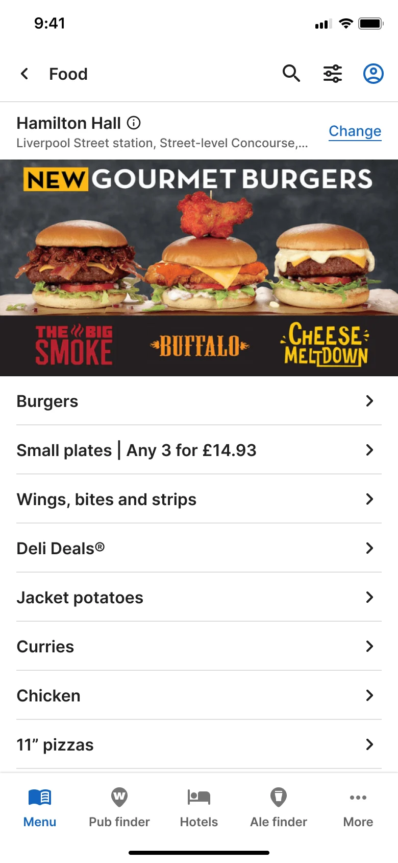 Mobile app food menu screen for Hamilton Hall pub, Liverpool Street station. A banner advertises three new gourmet burgers — The Big Smoke, Buffalo, Cheese Meltdown. Below, a list of menu categories: Burgers, Small plates, Wings, Deli Deals, Jacket potatoes, Curries, Chicken, Pizzas. Bottom navigation bar shown.