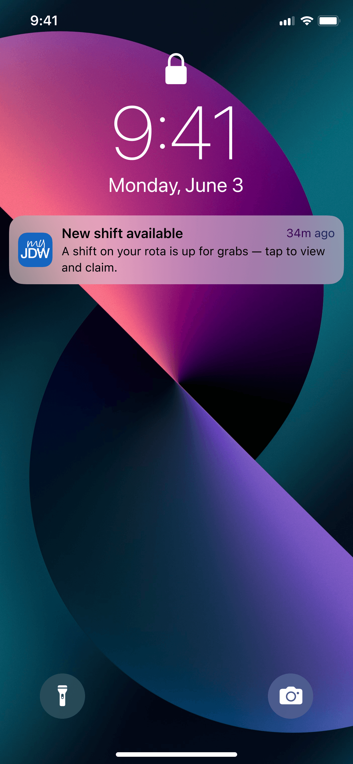 iPhone lock screen showing 9:41 on Monday, June 3, with a myJDW push notification reading "New shift available — a shift on your rota is up for grabs, tap to view and claim." Purple and teal abstract wallpaper, flashlight and camera shortcuts at the bottom.